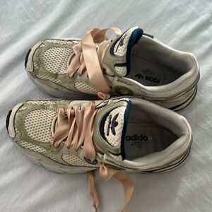 Gold and navy adidas sneakers